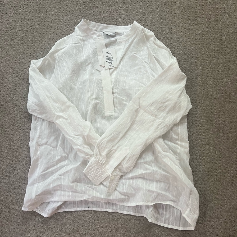 A Vince white v-neck blouse. Originally $255, I bought for $130.